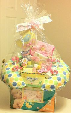 a basket filled with baby items sitting on top of a table