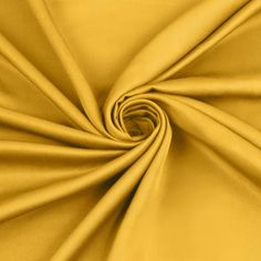 a close up view of a yellow fabric