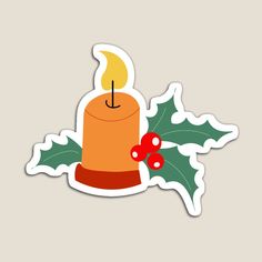 a christmas candle sticker with holly leaves and a red berry on the side, against a gray background