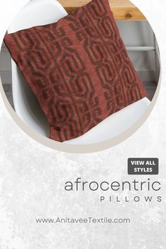 an image of a red pillow on a white chair with the text afrocentric pillows