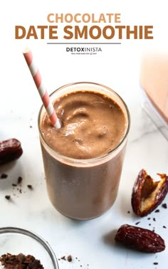 chocolate date smoothie in a glass with a straw