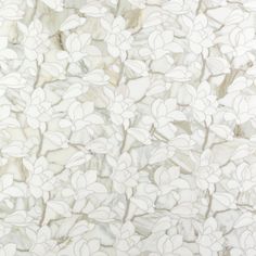 a white marble wall with flowers on it