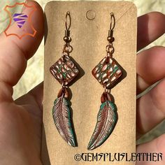 Welcome to GemsPlusLeather, where boho elegance meets artisan craftsmanship! Dive into the world of unique accessories with these Hand-Tooled Leather Boho Style Earrings featuring a captivating turquoise patina and copper accents.  These earrings are a nod to Bohemian chic, reflecting a carefree and artistic spirit. They are perfect for adding a touch of uniqueness to your daily attire or complementing your Boho-inspired outfits on special occasions. Don't miss the opportunity to own a piece of Bohemian Turquoise Leather Earrings, Handmade Leather Bohemian Earrings, Bohemian Hand-tooled Leather Earrings, Bohemian Hand Painted Brown Jewelry, Bohemian Brown Hand-painted Jewelry, Bohemian Hand-painted Copper Jewelry, Bohemian Hand Painted Copper Jewelry, Bohemian Hand Painted Brown Earrings, Brown Bohemian Hand Painted Earrings