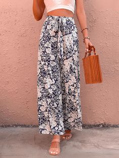 Unleash your inner fashionista with our Cancun Printed Wide Leg Belted Pant! Perfect for a day at the beach or a night out, these pants feature a fun print and a belted waist for a flattering fit. Say goodbye to boring pants and hello to style and comfort! Size Guide: Model is 5’6” tall, and has a 32.2” bust, 24.1”waist, & 35.6” hips. She is wearing a S / US 4 / AU 8. This pants is true to size. Material: 100% Rayon Feature: High rise. Belted Tie. Wide leg. Floral Printed. Back zipper closure. Relax Fit. Not lined. Care Instructions: Machine wash / Cold hand wash Trendy Boots, Leg Belt, Belted Pants, A Day At The Beach, Daily Dress, Dress Jewelry, Trendy Accessories, Day At The Beach, Comfortable Fashion