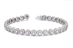 Experience the allure of "Timeless Enchanting Elegance" with our exquisite Cluster Bracelet, featuring an astonishing 4.26 carats of Natural Diamonds set in luxurious 18K White Gold.  DETAILS:  Metal: 18kt White Gold    Weight: 11.45 grams  Gemstone: Natural Diamonds  Shape: Round Brilliant  Total Carat Weight: 4.26CT Number of Diamonds: 228 Average Clarity: VVS Colour: F-G Length: 18cm Closure: Box Clasp  CERTIFICATE: Authenticity Certificate Included  The overall effect of the flower pattern a Platinum Diamond Wedding Bracelet, Luxury Round Platinum Diamond Bracelet, Luxury Diamond Bracelet With Halo Setting, Luxury Tennis Bracelet With Halo Setting For Formal Events, Luxury Tennis Bracelet With Halo Setting For Formal Occasions, Luxury Diamond Bracelets With Halo Setting, Luxury Diamond Bracelet With Halo Setting For Formal Events, Luxury Diamond Bracelet With Halo Setting For Formal Occasions, Diamond Bracelets With Halo Setting For Wedding