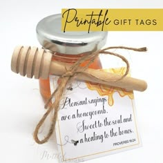 a jar of honey and a wooden stick with a tag on it that says, printable gift tags