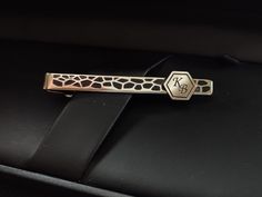 Adds a touch of class to any outfit with our unique silver patterned tie bar with initials engraved, that is a sophisticated and stylish accessory for every real men. These initials engraved tie clip is a must-have accessory in his wardrobe. Each of our monogrammed brass tie clips are handcrafted with precision and care, ensuring a high-quality and unique product that is sure to impress. The best material gives it a classic and timeless look, while the hand-tooled pattern and  blueing technique adds a touch of modernity and elegance. Make it even more special by personalizing it with your loved one's initials. It's a perfect gift for any occasion, including weddings, birthdays, anniversaries, or simply as a thoughtful gesture to show your appreciation. This tie clip is not only a stylish a Silver Formal Jewelry With Initials, Elegant Silver Jewelry With Engraved Logo, Elegant Silver Suit And Tie Accessories For Gift, Silver Elegant Suit And Tie Accessories For Gift, Luxury Silver Jewelry With Engraved Logo, Silver Suit And Tie Accessories For Father's Day Gift, Elegant Adjustable Suit And Tie Accessories For Gifts, Luxury Silver Suit And Tie Accessories For Business, Modern Silver Suit And Tie Accessories For Business