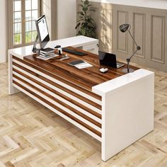 an office desk with a laptop on it in front of a window and wooden floor