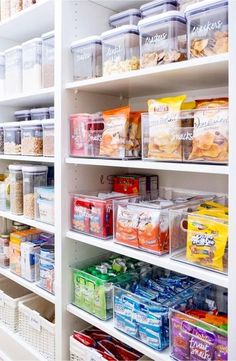 the shelves are filled with various types of snacks and other foods in plastic bins