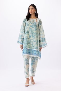 This monochrome organza shirt features delicate Aari embroidery in peacock and foliage imagery. Paired with a chiffon dupatta with embroidered borders and a raw silk izaar that is finished with intricate scalloped embroidery borders. Ice Blue Color Palette, Daman Design, Sania Maskatiya, Royal Wardrobe, Embroidery Borders, Ice Blue Color, Organza Shirt, Lawn Suit, Blue Color Palette