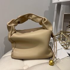 Real Smooth Leatherbeige Colorgolden-Tone Hardware H 5.5 In.(Without Handle)/W 8 In./D 4.5 In. Beige Pouch Shoulder Bag With Handles, Chic Beige Shoulder Bag With Gold-tone Hardware, Beige Shoulder Evening Bag With Detachable Handle, Beige Evening Shoulder Bag With Detachable Handle, Beige Tote Evening Bag For Shopping, Chic Beige Hobo Bag With Gold-tone Hardware, Beige Crossbody Evening Bag For Shopping, Beige Rectangular Hobo Bag With Handle Drop, Chic Cream Hobo Bag With Gold-tone Hardware