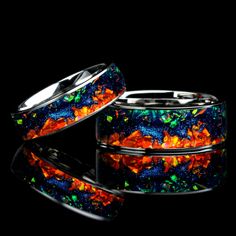 "💕 Unleash the beauty of the cosmos with our stunning Carina Nebula Galaxy Ring. This unique his and hers fire opal wedding band set features 8mm and 6mm bands with a mesmerizing mountain pattern, inspired by the mesmerizing night sky. Each ring is handcrafted with striking flashes of color, mimicking the cosmic wonder of the Carina Nebula as captured by the James Webb telescope. Make a statement with this one-of-a-kind ring set that symbolizes your cosmic connection to each other. 💕 Experienc Galaxy Jewelry Rings, Cosmic Wedding, Cosmic Ring, Webb Telescope, Mountain Pattern, Cosmic Connection, Couples Rings, Nebula Galaxy, Opal Wedding Band