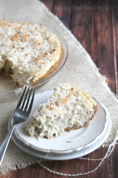 a piece of coconut cream pie on a plate with a fork