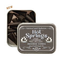 an open tin of hot springs with chocolate in it