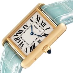 Cartier Tank Louis Yellow Gold Teal Leather Strap Mens Watch W1529756. Quartz movement. 18k yellow gold case 25.0 x 33.0 mm. Circular grained crown set with a blue sapphire cabochon. . Scratch-resistant mineral crystal. Silvered opaline dial with black radial Roman numeral hour markers and inner minute track. Sword shaped blue hands. Date calendar at 3 o'clock aperture. Secret Cartier signature at VII. Teal leather strap with 18K yellow gold tang buckle. Elegant Gold Cartier Watch Accessories, Vintage Gold Cartier Watch Accessories, Vintage Cartier Gold Watch Accessories, Timeless Gold Cartier Watch Accessories, Formal Gold Cartier Watch Accessories, Cartier Gold Watch With Rectangular Dial, Gold Cartier Watch With Rectangular Dial, Cartier Gold Watch Accessories For Formal Events, Cartier Gold Watch Accessories For Formal Occasions