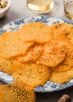 some crackers are on a blue and white plate