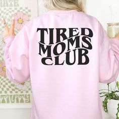 Cozy up in this ultra-soft Tired Moms Club Sweatshirt! Perfect for a snuggly night in, this stylish layering piece features a classic design for an effortlessly chic look. You'll show the world that yeah, you're tired...but you're still #momboss. ♥ We want you to be happy with your item, and for it to bring you joy! If you have any problems with your order or your item, please contact us prior to leaving a review. We will do what we can to take care of you and ensure that you are a happy custome Trendy Winter Sweater For Lounging, Trendy Spring Weekend Sweatshirt, Trendy Relaxed Fit Sweatshirt For Loungewear, Trendy Long Sleeve Weekend Tops, Trendy Long Sleeve Tops For Weekend, Trendy Long Sleeve Tops For The Weekend, Trendy Tops For Lounging In Fall, Trendy Relaxed Fit Tops For Lounging, Trendy Spring Sweater For Lounging