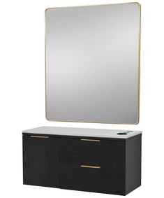 a large mirror sitting on top of a black dresser next to a white countertop