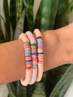 These lightweight Heishi bead bracelets are so fun for summer! They can be used for casual outfits or stacked up as a statement piece!  This listing is for ONE bracelet (your color choice) with gold accents and a rainbow center.  Each one is unique. Wear them alone or mix them up and make a stack! The possibilities are endless! The bracelets are 7", which fits average adult wrists.  I use a strong, stretchy cord for a nice, comfortable fit.  They are ready to ship for FREE! Happy shopping! Beach Friendship Bracelets With Spacer Beads, Bohemian Beaded Friendship Bracelets For Beach Party, Bohemian Pink Jewelry For Beach Party, Pink Heishi Beads Friendship Bracelets For Beach, Bohemian Letter Beads Beaded Bracelets For Beach, Bohemian Beaded Bracelets With Letter Beads For Beach, Bohemian Beaded Bracelets For Beach With Large Beads, Bohemian Beach Beaded Bracelets With Letter Beads, Heishi Beads Stretch Bracelet With Tiny Beads For Beach