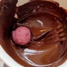 a scoop of ice cream and chocolate in a bowl