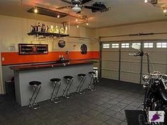 a motorcycle is parked in front of a bar with stools and barstools