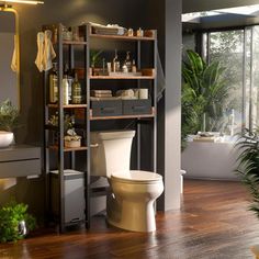 a bathroom with a toilet, sink and shelving unit in the middle of it