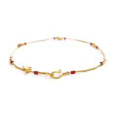 24K yellow gold, ruby beads 0.90cts total weight Preserving a piece of history from Ancient Anatolia, Fatih translates the master craftsmanship of prehistoric eminence into contemporary works of art. As show with: Gold and Emerald Bracelet, Gold and Sapphire Bracelet, and Gold and Lapis Bracelet. • 8" (20.32cm) length • 0.10" (0.25cm) maximum width • Hook and eye clasp Gold Ruby Single Strand Jewelry, Gold Jewelry For Rituals, Elegant Yellow Gold Bracelet For Puja, Gold Jewelry For Rituals, Hand-strung, Yellow Gold Jewelry With Polished Beads For Puja, Yellow Gold Ruby Bead Jewelry, Adjustable Yellow Gold Ruby Jewelry, Yellow Gold Ruby Bracelet, Hand-strung Gold Jewelry For Puja