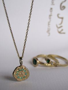 Gold Jewelry With Coin Pendant For May Birthstone, Gold-plated Round Emerald Necklace, Gold Dainty Emerald Necklace, Gold Plated Round Emerald Necklace, Round Gold Plated Emerald Necklace, Dainty Gold Emerald Round Necklace, Round Gold Plated Emerald Gemstone Necklace, 14k Gold Gemstone Flower Pendant Jewelry, Gold Gemstone Round Pendant Jewelry