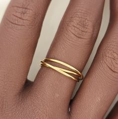 This interlocking ring features a versatile and stylish design, making it perfect for stacking or wearing on its own. Made from high-quality gold, this ring is a timeless accent piece that adds a touch of elegance to any outfit. A must-have for any jewelry collection. 14k gold filled interlocking fidget ring with 3 bands Chic Yellow Gold Open Band Jewelry, Elegant Gold Double Band, Modern Adjustable Stackable Rings With Round Band, Modern Stackable Toe Rings For Promise, Gold Double Band Rings With Modern Twist, Gold Rings With A Modern Twist For Promise, Adjustable Yellow Gold Rings For Everyday Use, Adjustable Double Band Stackable Promise Rings, Adjustable Double Band Stackable Rings For Promise