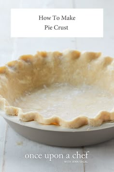 an uncooked pie crust sitting on top of a white table with text overlay