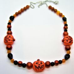 Acrylic Pumpkin Center Beads, With Crackle Glass And Black Solid Glass Pearl Beads And Howlite Black Skulls! Approximately 22 Inches, Made With Sterling Silver Chain And Clasp. Handcrafted! One Of A Kind. Pumpkin Centers, Pumpkin Necklace, Black Pumpkin, Crackle Glass, Black Skulls, Hand Crafted Jewelry, Crafted Jewelry, Black Solid, Black Orange