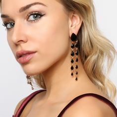 Feel elegant in these teardrop dangle earrings that flow with any outfit and elongate your neck. Cascading teardrop rhinestones that dangle in two tiers from large to small sizes with a post backing great for girls, teens, and women that have their ears pierced! These beautiful statement jewelry will shine like a diamond catching everyone’s eyes! Size• Length: 3.75 in (9.53 cm)• Width: 0.5 in (1.27cm) Quality These well designed post backing earrings use an eco-friendly, lightweight, strong gold Trendy Teardrop Dangle Earrings For Party, Teardrop Metal Chandelier Earrings For Party, Trendy Teardrop Jewelry For Parties, Metal Teardrop Chandelier Earrings For Party, Party Teardrop Metal Earrings, Crystal Long Drop Chandelier Earrings, Long Drop Crystal Chandelier Earrings, Chic Teardrop Chandelier Earrings For Party, Trendy Evening Dangle Chandelier Earrings