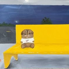 a painting of a cat sitting on a yellow bench