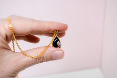 Style: Bezel, Pear Cut Metal: 14k Gold Gemstone: Onyx, Diamonds Quality: Genuine, H color, SI2 clarity Carat Weight: 0.05 carats diamonds Item Weight: 2.4 grams Height: 23 mm Signed: 14k H Vintage est. from the 1980s More item details available upon inquiry. * Quality You Can Trust * -Items have been evaluated by a professional gemologist for authenticity. -Ruby & Juniper is a Vintage Jewelry boutique, this means we only carry one of each item, so everything you find is uniquely yours. I str Classic Onyx Pendant Jewelry, Onyx Necklace Vintage, Elegant Onyx Oval Pendant Jewelry, Modern Onyx Pendant Jewelry, Polished Onyx Round Pendant Jewelry, Gold Vintage Jewelry, Diamond Necklace Gift, Tanzanite Necklace, Onyx Pendant