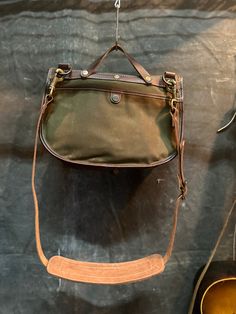 This is an updated take on a classic design. Large enough to fit your daily essentials but small enough to take everywhere. Built tough from waxed cotton canvas and leather. DIMENSIONS: 12”w x 10”h x3”d Vintage Leather Canvas Bag With Canvas Lining, Classic Canvas Bag With Waxed Finish, Classic Outdoor Waxed Canvas Shoulder Bag, Classic Waxed Canvas Shoulder Bag For Outdoor, Functional Canvas Bag With Waxed Finish, Classic Waxed Canvas Shoulder Bag For Everyday, Vintage Waxed Canvas Bag With Leather Handles, Classic Waxed Canvas Everyday Shoulder Bag, Vintage Waxed Canvas Shoulder Bag With Waxed Finish