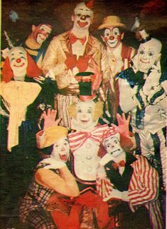 a group of clowns posing for a photo