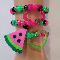 These kandi bracelets are made with glitter pink,green and black pony beads and cute charms. These are made in all different sizes. One size fits most. Perfect for any event! You will get lots of compliments in this unique wearable art! Stand out at your next event! Edm festival  Raves Party  Rave outfit  Festival outfit Pride Party favors  Birthday gifts Stocking stuffer  Rave anniversary  Rave gift Watermelon Bracelet, Bracelets Kandi, Bracelets Hippie, Pride Party, Rave Outfits Festivals, Diy Kandi Bracelets, Hippie Bracelet, Diy Kandi, Outfit Festival