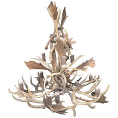 a chandelier with antlers hanging from it's sides