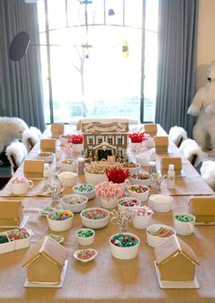 the table is set with candy and candies