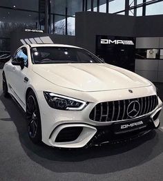 the mercedes amg coupe is on display at an auto show