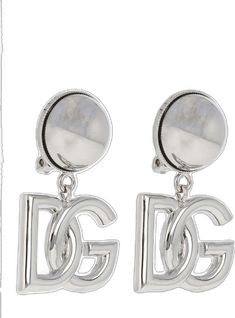 Designer Silver Dangle Jewelry, Designer Round Metal Earrings, Designer Metal Drop Earrings, Designer Single Metal Earring, Designer Silver Earrings With Polished Finish, Luxury White Gold Metal Earrings, Designer Silver Clip-on Earrings, Designer Silver Clip-on Jewelry, Luxury Metal Clip-on Earrings