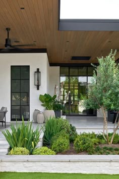 the front porch is clean and ready to be used as an outdoor living room area