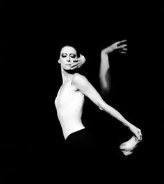 a black and white photo of a ballerina