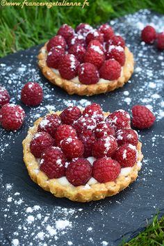 raspberry tarts with powdered sugar on top