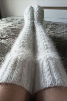 High socks are knitted from angora with the addition of nylon (for durability). Angora yarn is made from angora rabbit down, so the socks are very soft and delicate. These long socks are warm, cozy and fluffy. Look how These socks can be called stockings) You can wear them when doing household chores or when watching TV on the couch. You will look very impressive! Dress them in bed and you will be warm, soft and cozy. I knit with premium quality yarn. Composition: 80% angora (rabbit), 20% polyam Soft White Knee-high Socks For Winter, Comfortable Warm White Knee-high Socks, Comfortable White Knee-high Leg Warmers, White Knee-high Comfortable Leg Warmers, White Warm Knee-high Socks, Warm White Knee-high Socks, Cozy Thick White Socks, Thick Knitted White Socks, Cozy White Knee-high Socks One Size