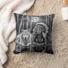 a black and white pillow with a native american wolf