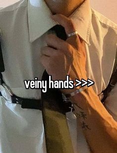 a man wearing a white shirt and tie with the words very hands > > >