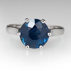 a ring with a blue stone in it