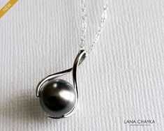 Dark Grey Pearl Drop Sterling Silver Pendant Necklace with .925 Sterling Silver Chain. PLEASE READ ITEM DESCRIPTION and SHOP POLICIES before placing your order, and contact me with any questions! CHAIN is 18 inches (45.7 cm) long. PENDANT is about 0.78 inch (2 cm) long including bail. PEARL is 10mm. NECKLACES SECTION: https://www.etsy.com/shop/LanaChayka?ref=seller-platform-mcnav&section_id=17026331 BRIDAL NECKLACES SECTION: https://www.etsy.com/shop/LanaChayka?ref=seller-platform-mcnav&section_ Bridal Necklaces, Grey Jewelry, Dainty Pendant Necklace, Women Necklaces, Gray Jewelry, Wedding Necklaces, Pearl Bridal Jewelry, Wedding Pendant, Dainty Pendant