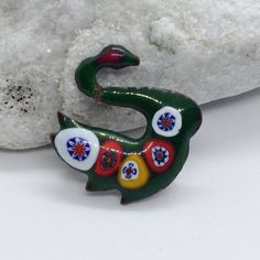 A great gift for mom, wife or girlfriend. Rare vintage brooch in the form of a bird.Very delicate work.Green- blue enamel . Size 2 cm x 2 cm          0.6 in x 0.6 in I'm always happy to combine multiple items to save on shipping,just ask! International Buyers Attention! Please be aware that there may be VAT, import or customs fees in your country. These fees are your responsibility and I may not be aware of the fees for each country. Please contact your local postal service for more information. Green Brooch Enamel Pin For Gift, Green Enamel Brooch Pin As Gift, Green Enamel Pin Brooch For Gift, Handmade Green Enamel Brooches, Unique Green Enamel Pin Gift, Enamel Brooch Lapel Pin Gift, Unique Handmade Collectible Enamel Pin, Handmade Antique Enamel Pin For Gift, Artistic Green Brooches For Gifts